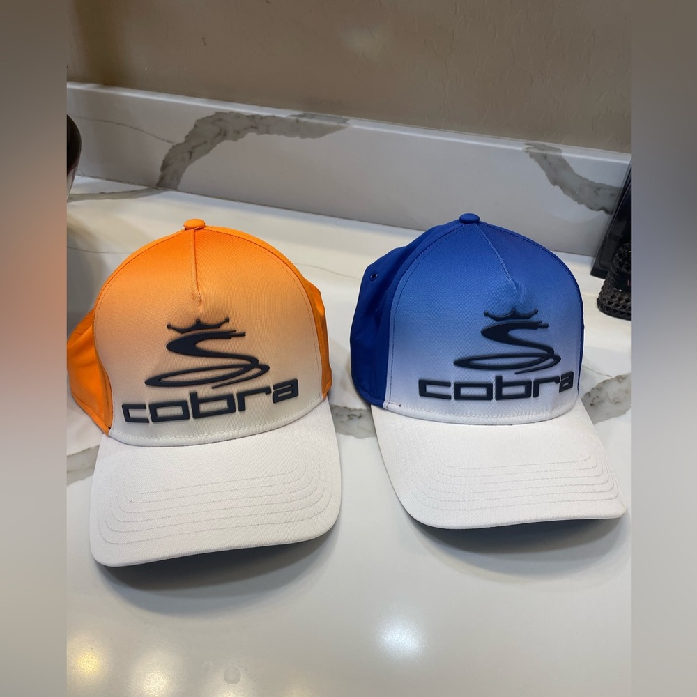 Pair Cobra Golf hats/ one size. Never worn.